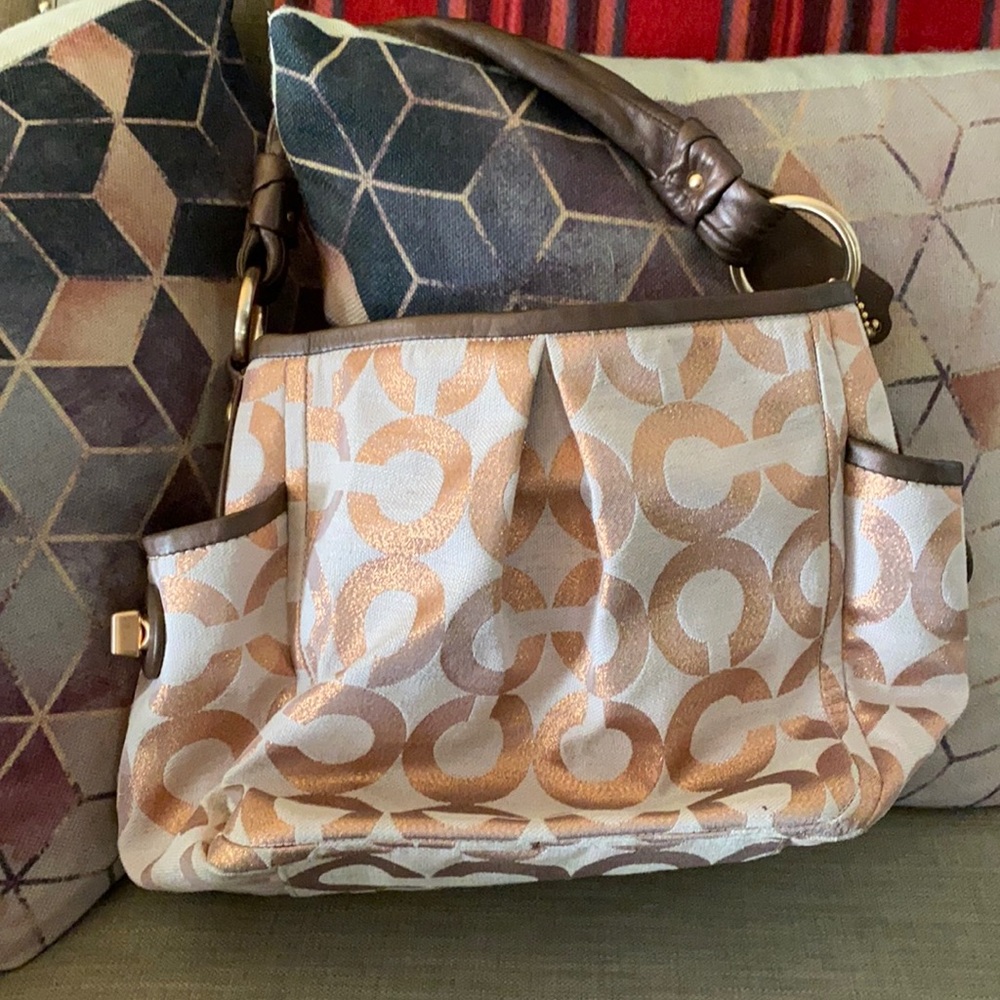 Pink Coach bag with rose gold accents